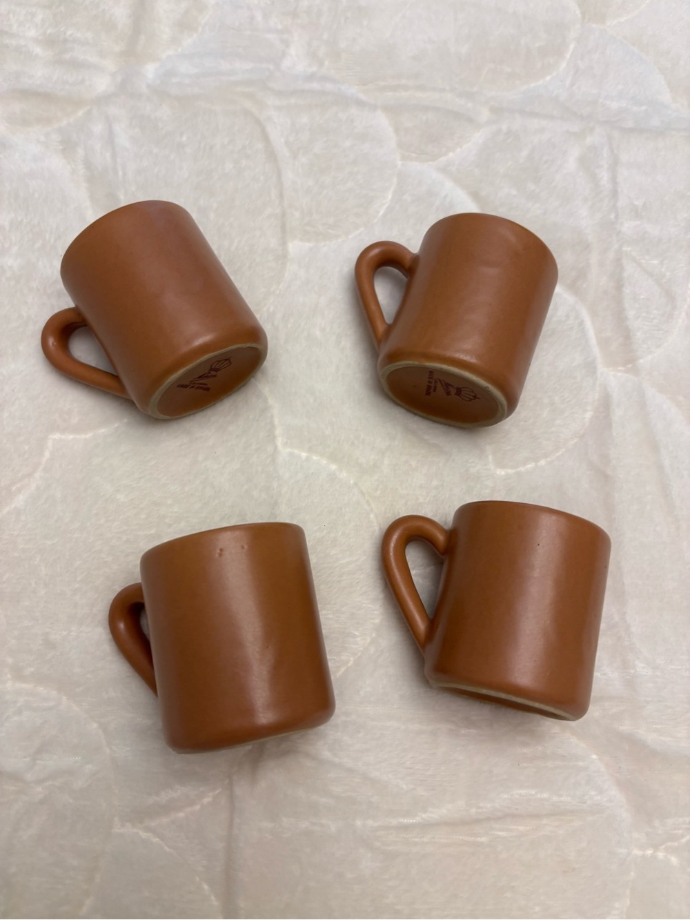 Four brown stoneware pottery expresso shot coffee mugs